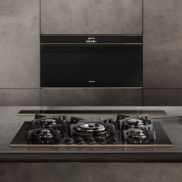SMEG GÁZ FŐZŐLAP, Dolce Stil Novo , 75 cm,  5 gázégő, öntöttvas edénytartók, fekete üvegkerámia alap réz díszítésselítésselsel